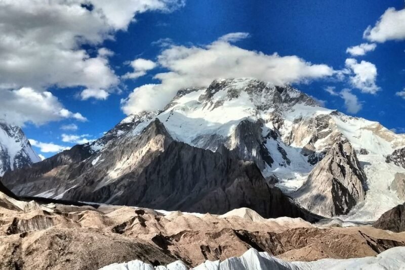 The massif above the glacier with cloud building over the ridge